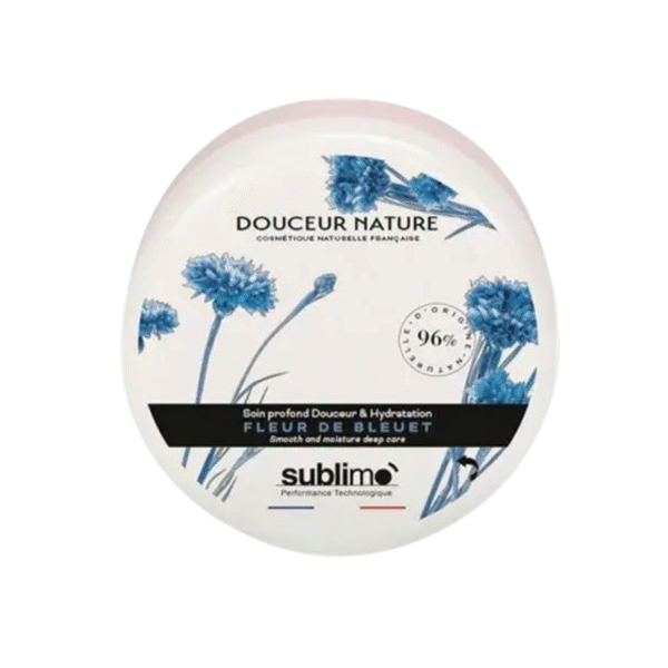 Un contenant rond de Soin Profond Douceur & Hydratation Fleur de Bleuet-150 ml, orné d'un motif de bleuet bleu et d'un texte en français, met l'accent sur une hydratation en profondeur avec 96 % d'ingrédients naturels.