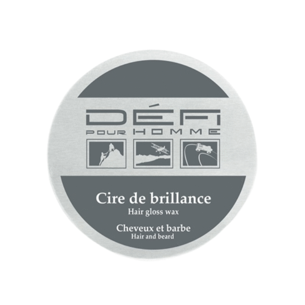 Une boîte ronde en argent étiquetée « Cire de Brillance - Défi pour Homme - 75 mlmatifiante » présente des icônes de montagne, de voiture et d'avion, offrant une finition naturelle pour les cheveux et la barbe.
