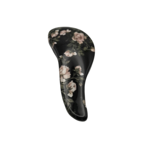 Le Brosse Méli-Mélo Noire Fleurs présente un manche incurvé et un motif floral rose, parfait pour un démêlage en douceur, sur fond blanc.