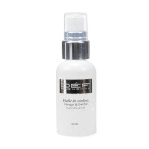 Huile de confort visage et barbe - Défi pour Homme - 50ml est un flacon blanc avec pompe doseuse, conçu pour hydrater et apporter un confort quotidien au visage et à la barbe des hommes.