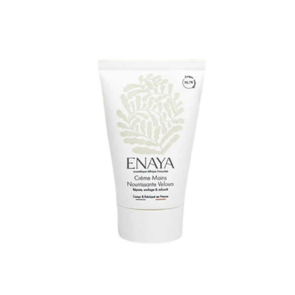 Un tube blanc de 50 ml de Crème mains nourrissantes velours-Enaya présente un design botanique beige clair avec du texte français et anglais sur le devant.