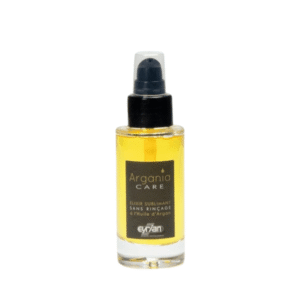 Un petit flacon transparent de 50 ml d'Elixir Sublimant-Argania Care-Eyrian avec un liquide jaune et un distributeur à pompe noir, étiqueté en français comme « soin cheveux sublimant huile d'argan Eyrian », est présenté sur un fond blanc.