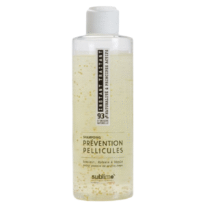 Un flacon transparent de 200 ml de Shampooing Prévention Pellicules - Traitement Instantané - avec un bouchon à clapet blanc et des paillettes dorées. L'étiquette met en avant la prévention antipelliculaire, l'hydratation et le soin pour un cuir chevelu sain.