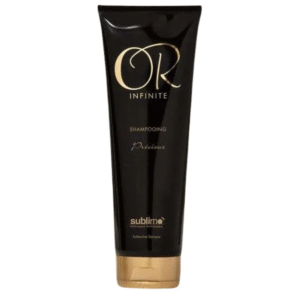 Le Shampooing Sublimant-Or Infinite-Sublimo-250 ml se dresse sur un fond blanc, idéal pour celles qui recherchent des cheveux brillants et hydratés.