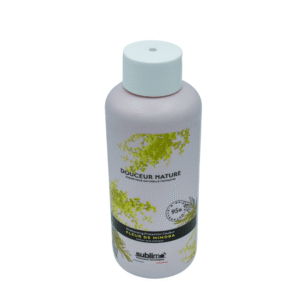 Un flacon rose de Gel Douche Douceur Nature aux motifs de fleurs de mimosa côtoie le Shampoing Fleur de Mimosas -Sublimo-250ml ; tous deux présentent des bouchons blancs et mettent en valeur 95% d'ingrédients naturels.