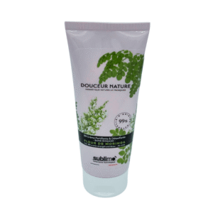 Un tube de 100ml de BB crème capillaire Fleur de Moringa-Sublimo, avec des feuilles de moringa vertes sur fond clair et une étiquette mentionnant 99% d'ingrédients d'origine naturelle.
