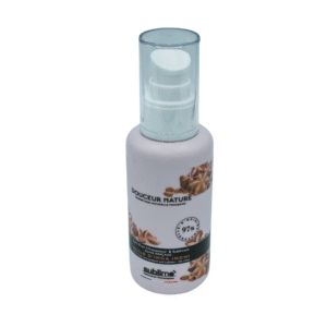 Un flacon blanc de 100 ml de soin capillaire Soin Douceur 10 en 1 - Huile d'Inca Inchi est doté d'un distributeur à pompe, d'images d'anis étoilé et d'une étiquette indiquant 97 % d'ingrédients d'origine naturelle pour une nutrition douce et efficace.
