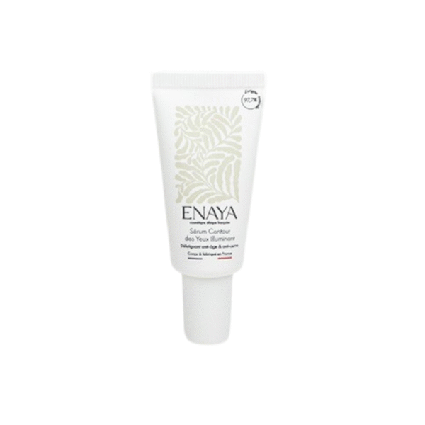 Un tube blanc de 15 ml de Sérum Contour des yeux Illuminant -ENAYA, avec des motifs de feuilles subtils et un texte sur le devant, est présenté sur un fond blanc uni.