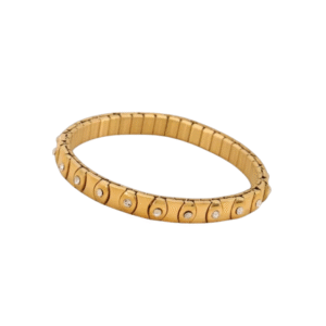 Le Bracelet contemporain - strass transparent /Doré est un bracelet extensible de couleur or à la finition lisse, orné de pierres rondes transparentes serties dans des chatons régulièrement espacés sur le pourtour de la bande.