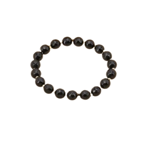 Le bracelet perles en pierres style bouddhiste / noir présente des perles noires rondes et brillantes, régulièrement espacées et enfilées dans un design circulaire classique, sur un fond blanc.