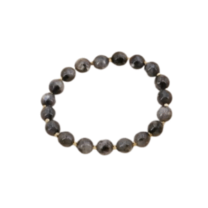 Un bracelet perlé avec des pierres rondes gris foncé et des entretoises dorées est disposé en cercle sur un fond blanc. Inspiré du "Bracelet perles en pierres style bouddhiste / Gris foncé" pour un style unique et élégant.