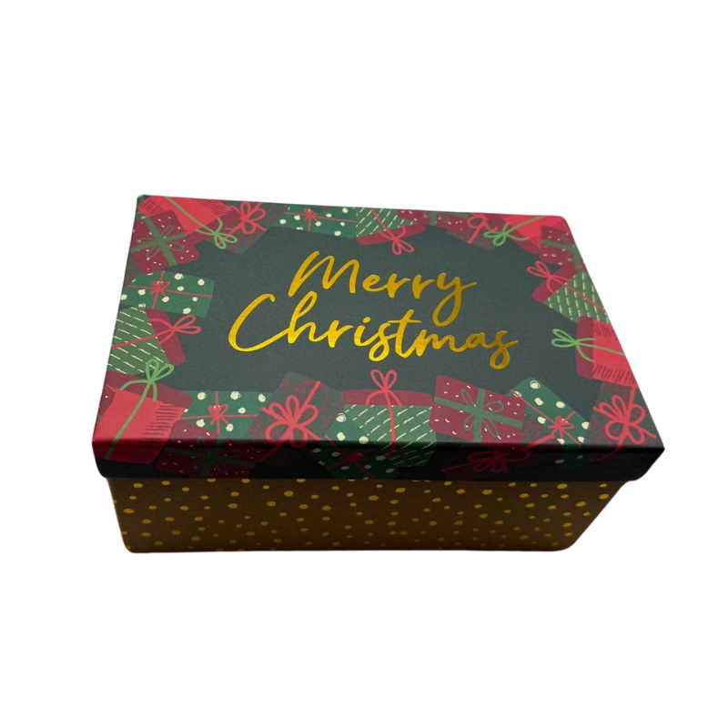 La Boîte Cadeau -Rectangulaire -Noël -Merry Christmas présente un couvercle avec des cadeaux rouges et verts et la mention dorée "Merry Christmas", ainsi qu'une base avec des pois dorés sur fond sombre, idéale pour les cadeaux de Noël.