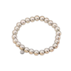 Le Bracelet grosses billes style contemporain, en acier inoxydable argenté, est composé de grandes perles lisses formant un cercle moderne avec un petit pendentif métallique, présenté sur un fond blanc épuré.