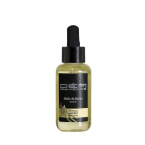 Un flacon transparent Défi Pour Homme Huile de barbe parfumée-Vanille Ambrée de 50 ml avec un bouchon compte-gouttes noir et une étiquette portant « Huile de barbe, Vanille Ambrée » et un motif vanille. L’huile à barbe nourrissante parfaite pour les hommes.