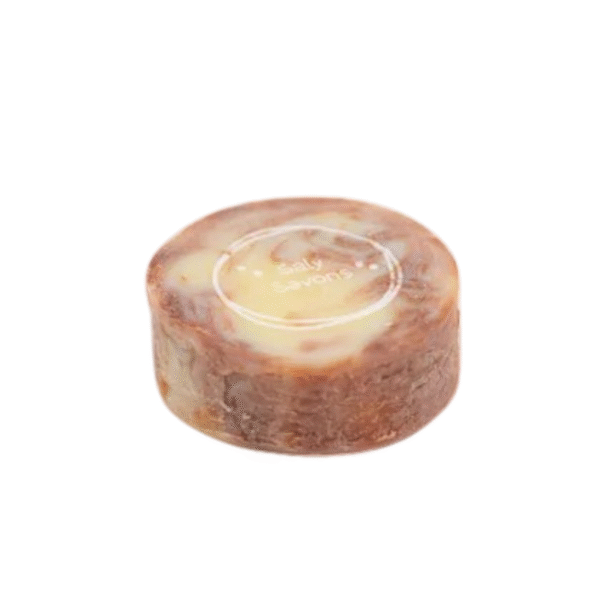 Un pain de savon rond, marbré marron et crème, étiqueté « Savon Bourrache et Linaloé -120g-Saly Cosmétiques » se pose élégamment sur un fond blanc épuré.