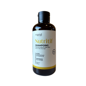 Flacon de 200 ml de Shampoing Nutritif – Cheveux très Secs pour cheveux très secs, à la Provitamine B5 et à la Vitamine B5, doté d'un bouchon noir et d'une étiquette blanche aux accents jaunes.